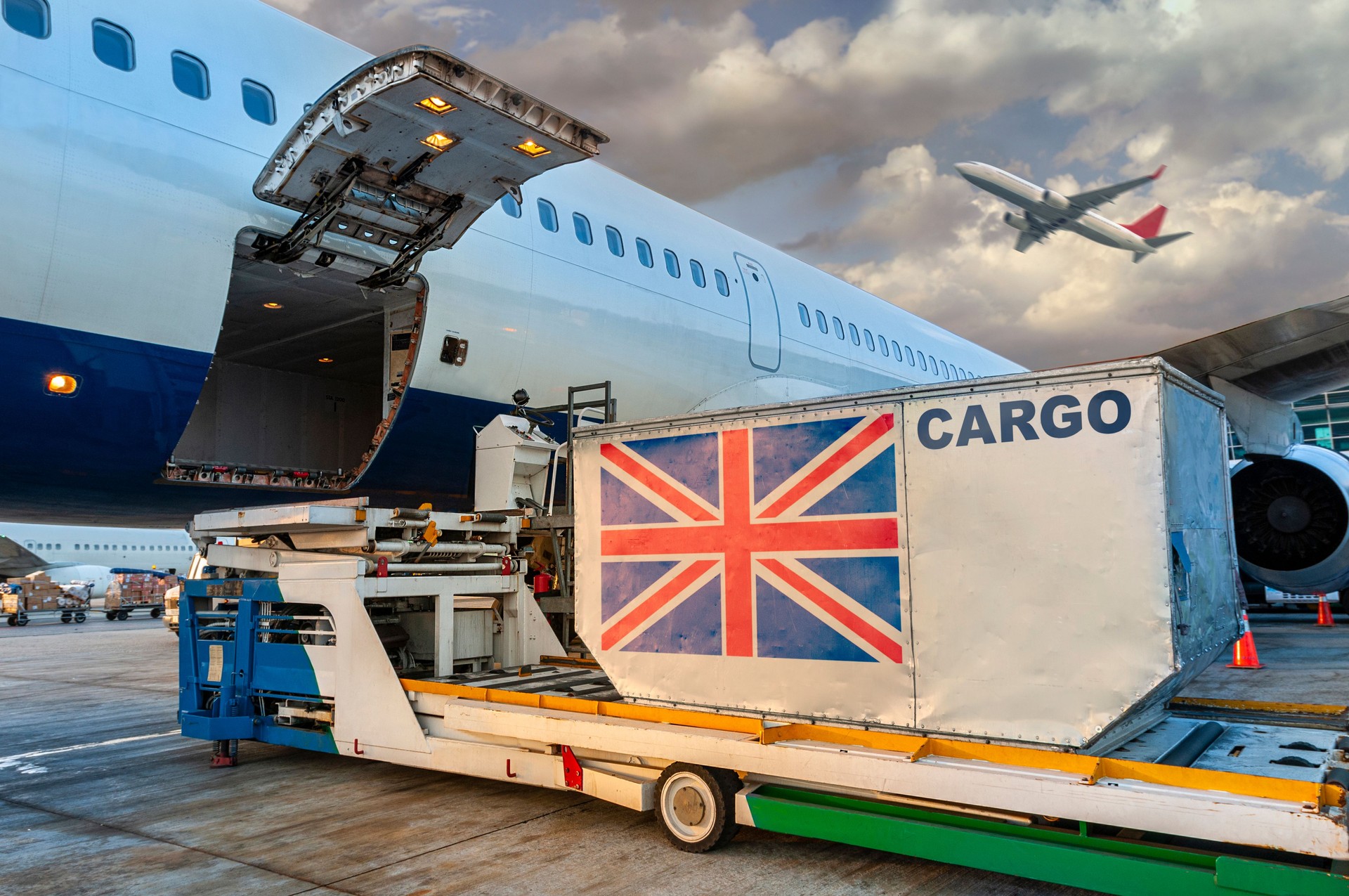 Loading the container in the cargo airplane.